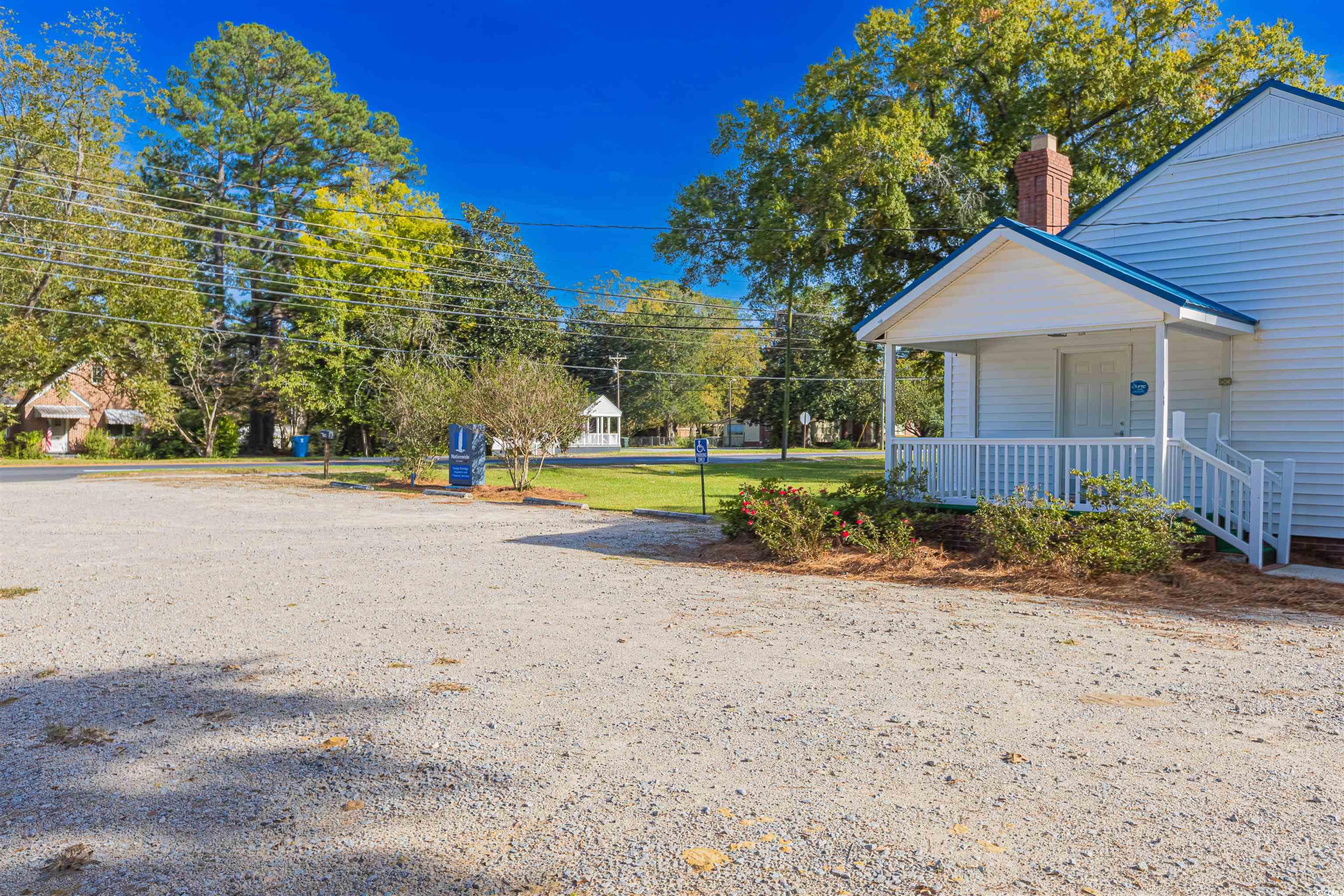 505 North Longstreet Street Kingstree, SC 29556 - Photo 27 of 34 View of community featuring a porch and a yard