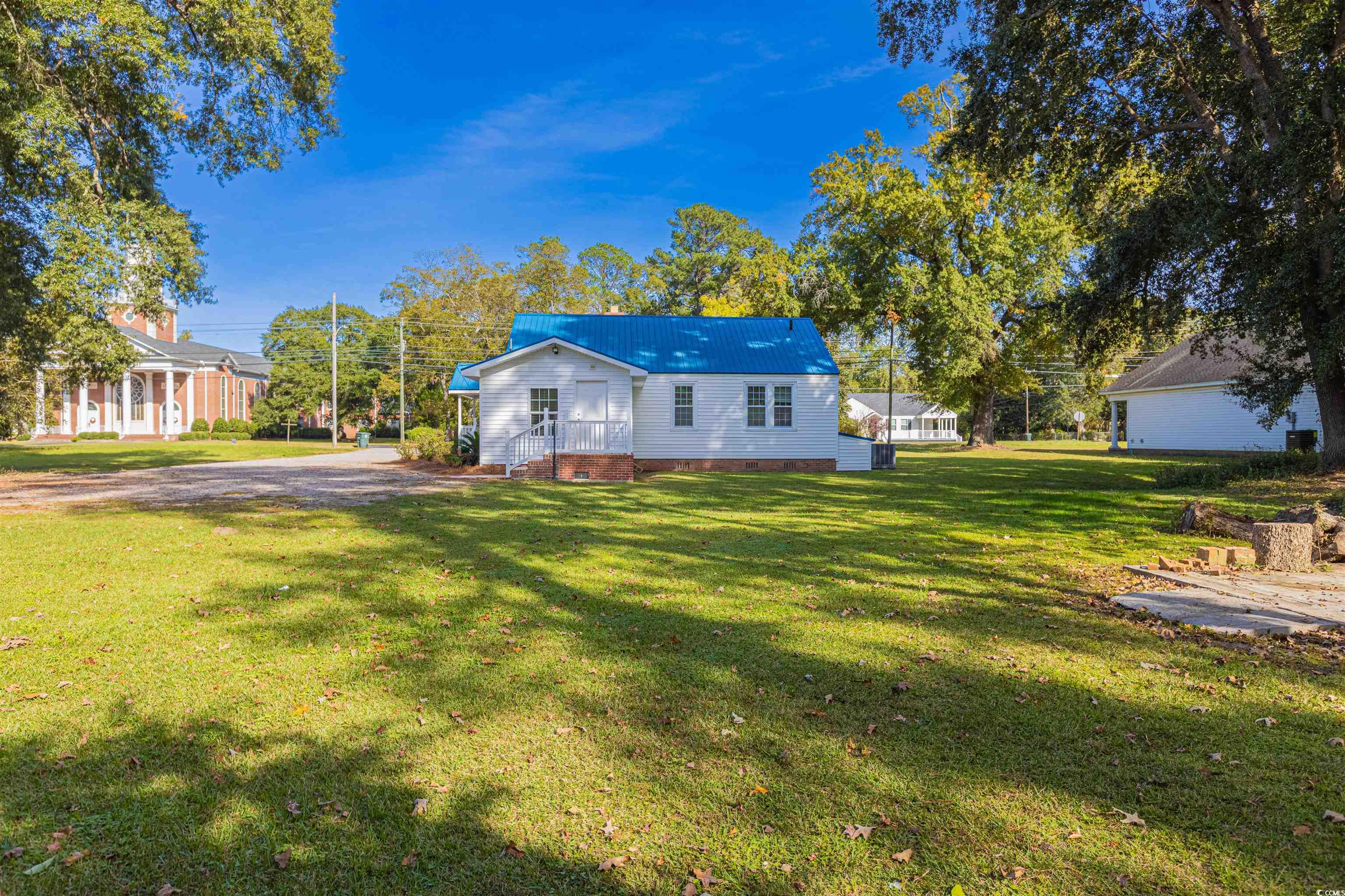 505 North Longstreet Street Kingstree, SC 29556 - Photo 29 of 34 Rear view of house featuring a lawn