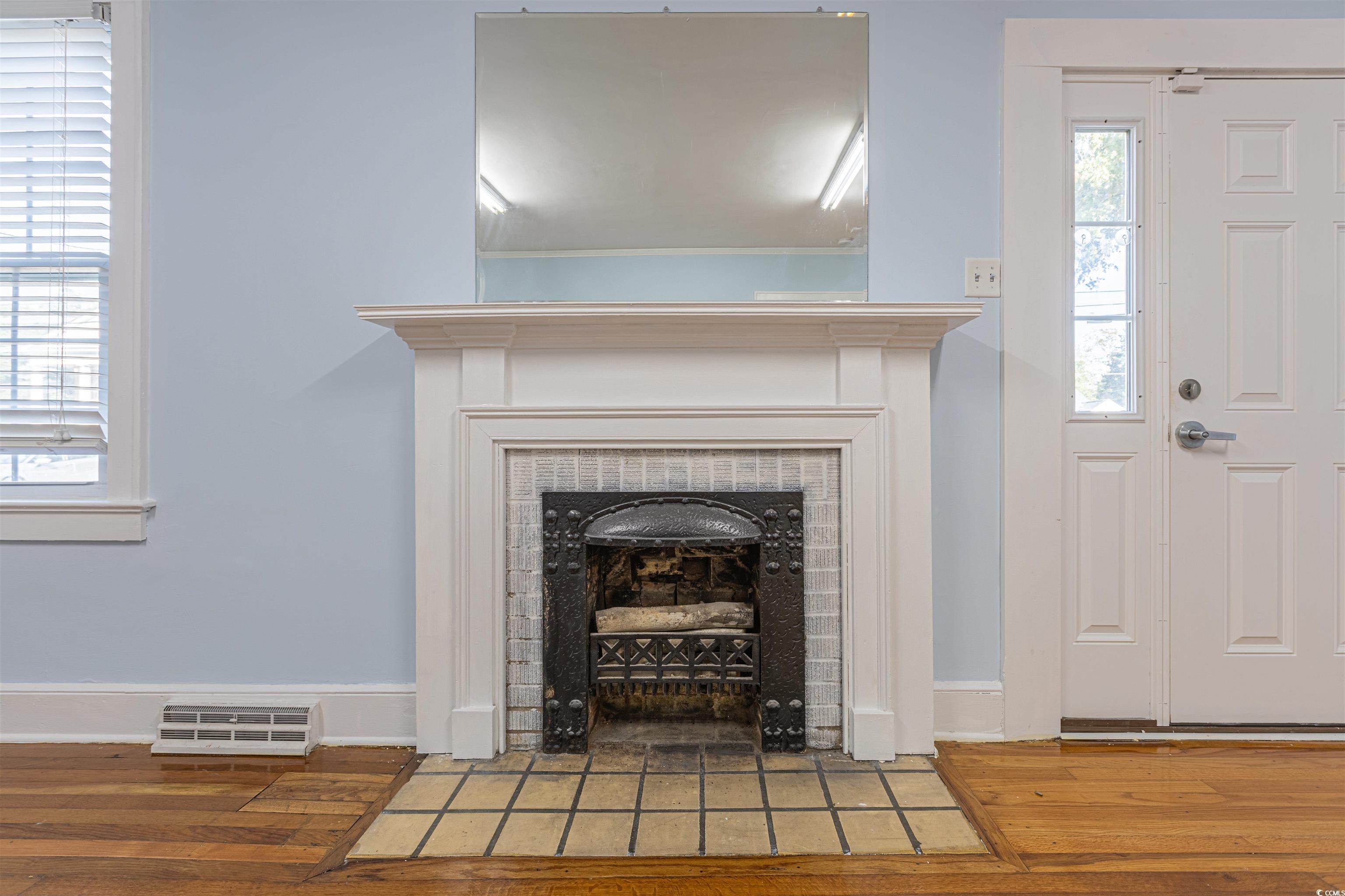 505 North Longstreet Street Kingstree, SC 29556 - Photo 7 of 34 Detailed view of wood finished floors and a tile fireplace