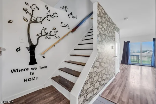 a view of entryway with wooden floor