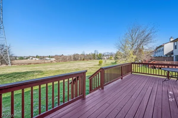 a view of a balcony with wooden floor