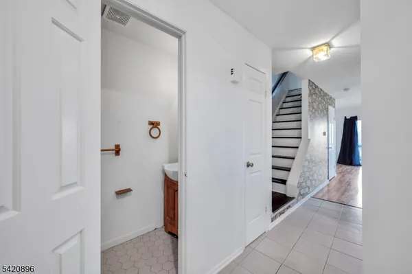 a view of entryway with wooden floor