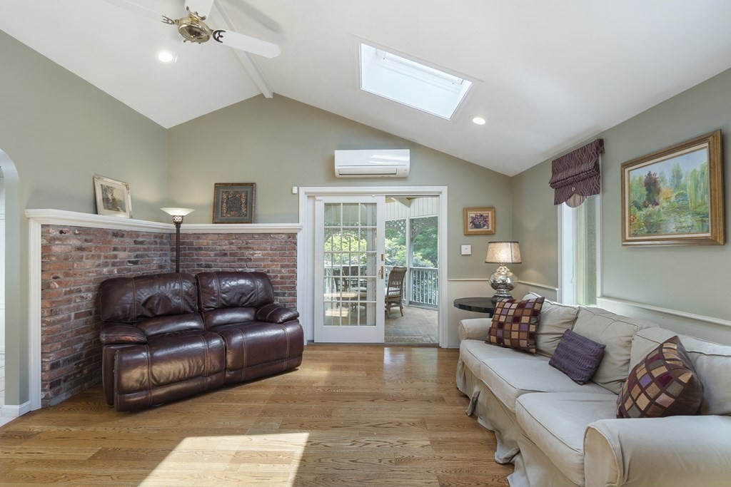 57 Surrey Lane Boxford, MA 01921 - Photo 14 of 42 a living room with furniture and a fireplace