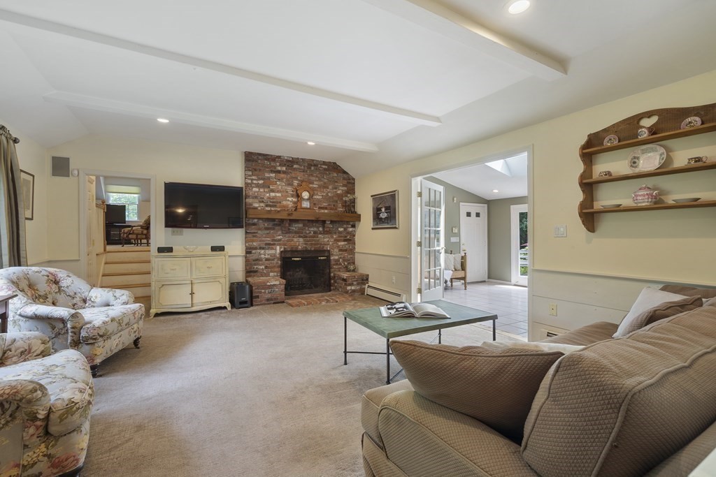 57 Surrey Lane Boxford, MA 01921 - Photo 18 of 42 a living room with furniture and a fireplace