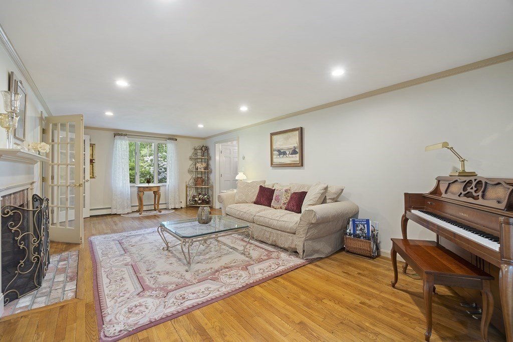 57 Surrey Lane Boxford, MA 01921 - Photo 3 of 42 a living room with furniture and a fireplace