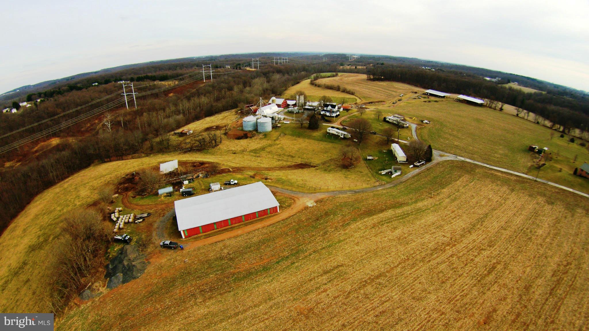 28055 Ridge Road Mount Airy, MD 21771 - Photo 1 of 30 an aerial view of a house with a swimming pool
