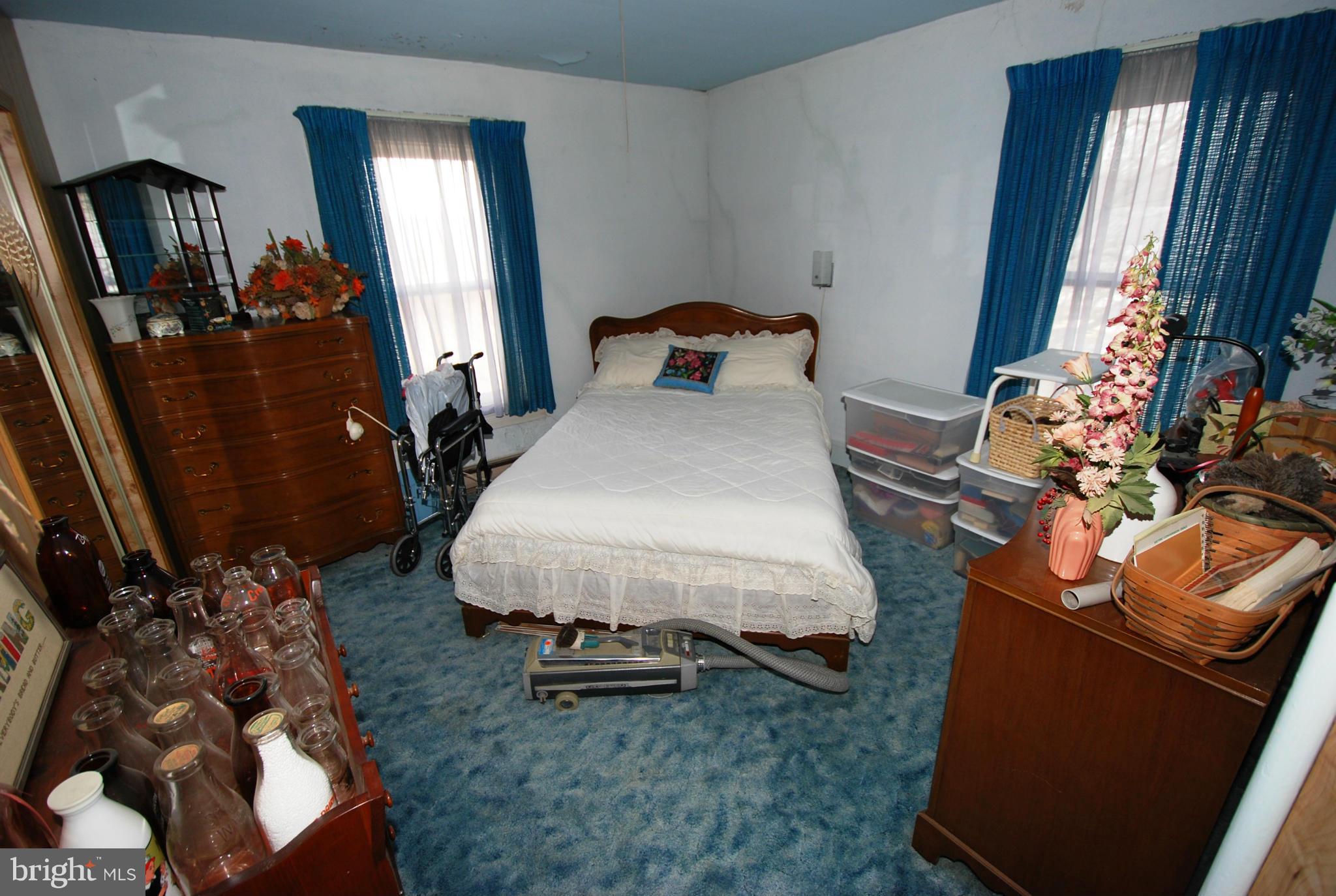 28055 Ridge Road Mount Airy, MD 21771 - Photo 18 of 30 a bedroom with bed and a mirror