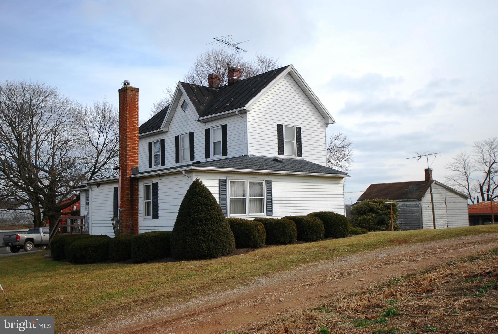 28055 Ridge Road Mount Airy, MD 21771 - Photo 7 of 30 a front view of a house with a yard
