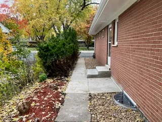 a view of a pathway with a house