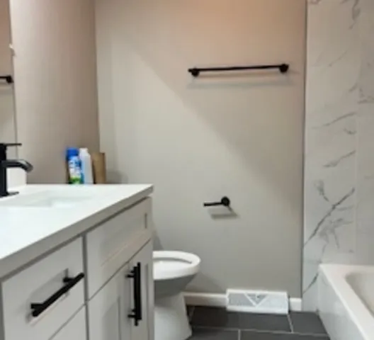 a bathroom with a sink and a toilet