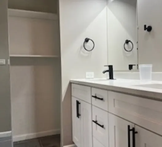 a bathroom with a sink and mirror