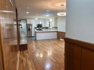 a view of deck with wooden floor and fence