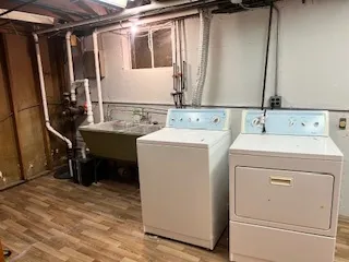 a kitchen with stainless steel appliances kitchen island a refrigerator and a sink