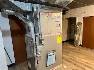 a view of a kitchen with a sink and cabinets