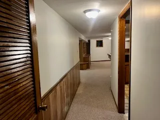 an empty room with furniture and natural light