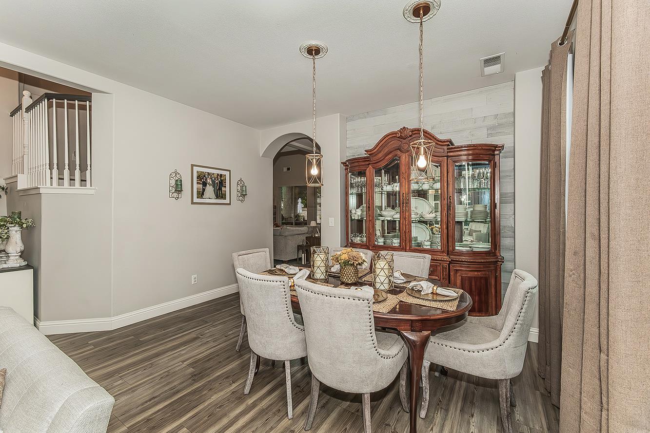 1175 Applegate Avenue Clovis, CA 93611 - Photo 14 of 65 a view of a dining room with furniture window and wooden floor
