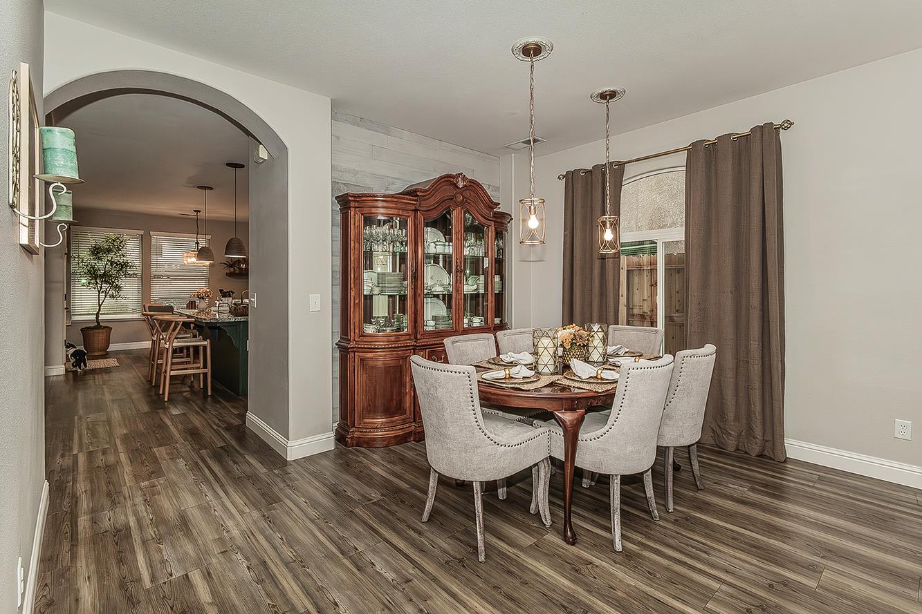 1175 Applegate Avenue Clovis, CA 93611 - Photo 15 of 65 a view of a dining room with furniture window and wooden floor