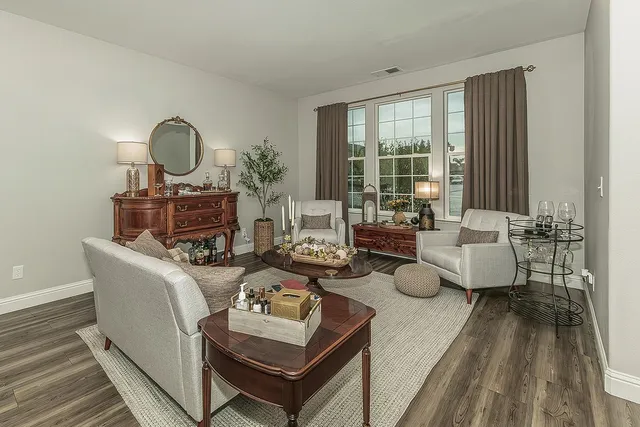 a bathroom with a sink mirror and vanity