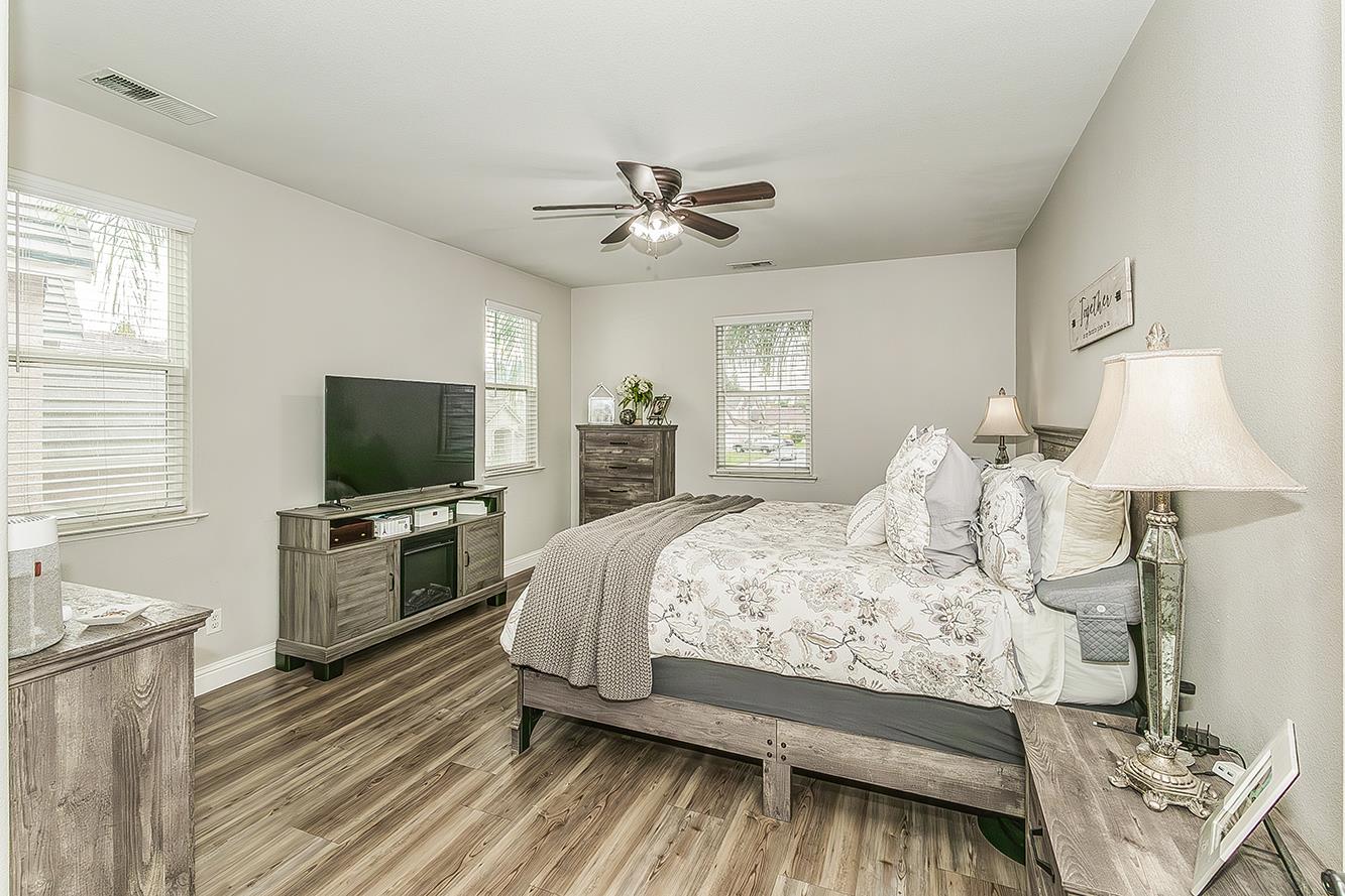 1175 Applegate Avenue Clovis, CA 93611 - Photo 22 of 65 a bedroom with a bed and a flat screen tv