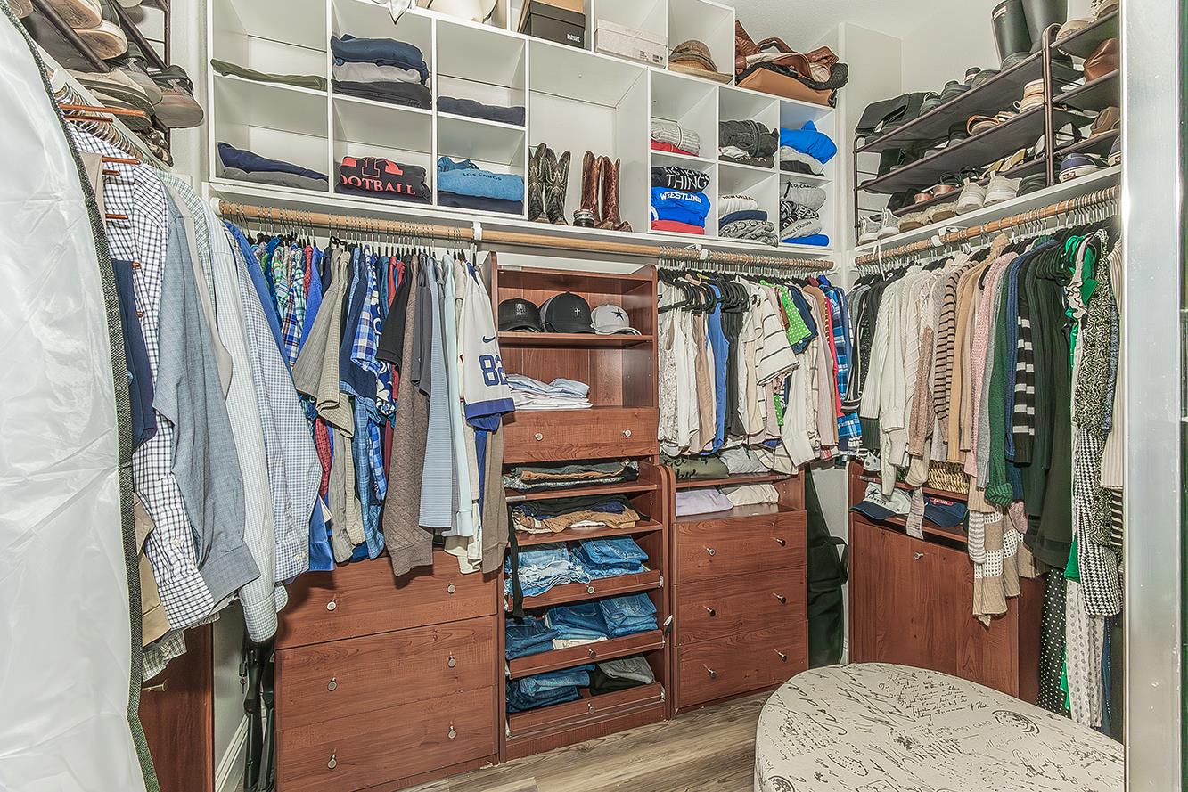 1175 Applegate Avenue Clovis, CA 93611 - Photo 26 of 65 a view of walk in closet with clothes and shoes