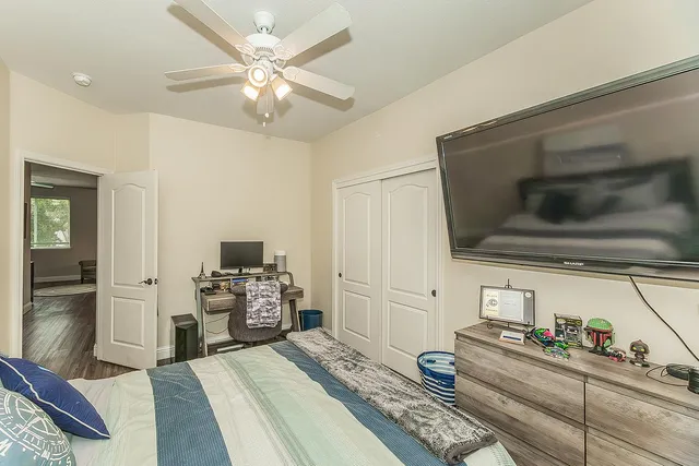 a bedroom with furniture and a window