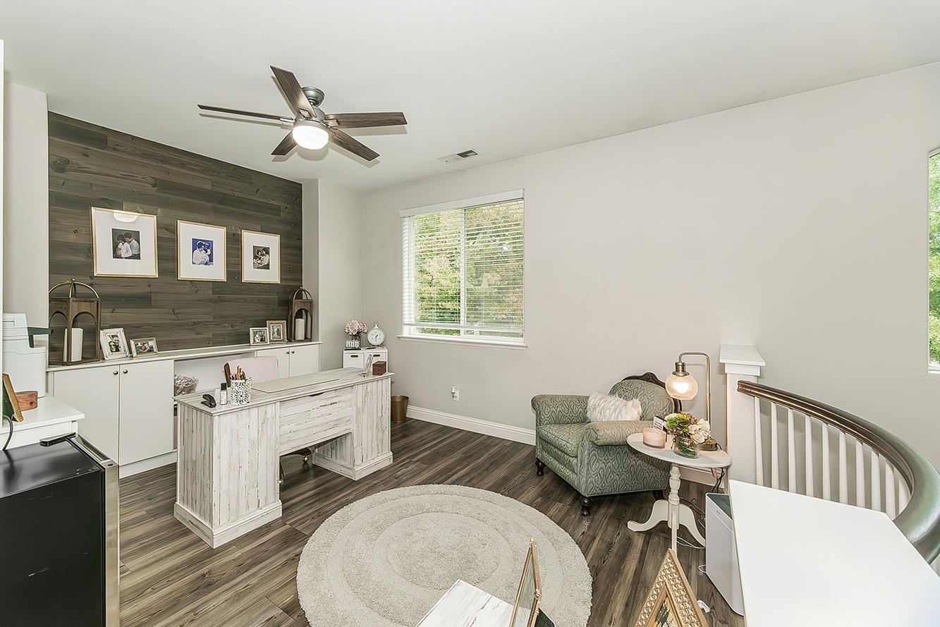 1175 Applegate Avenue Clovis, CA 93611 - Photo 32 of 65 a living room with furniture and a chandelier