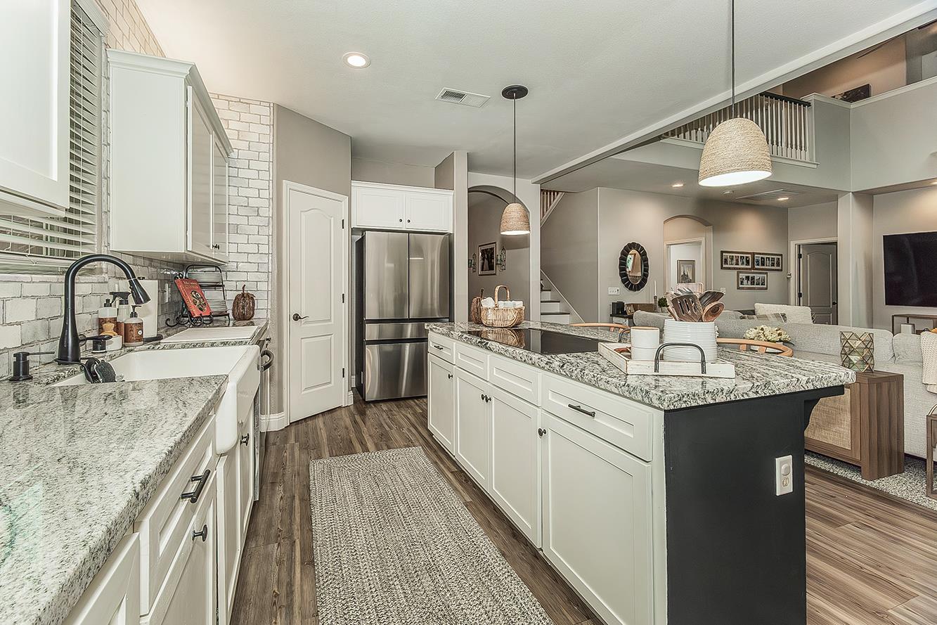 1175 Applegate Avenue Clovis, CA 93611 - Photo 4 of 65 a kitchen with stainless steel appliances granite countertop a sink refrigerator and cabinets