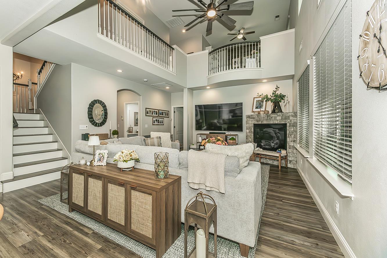 1175 Applegate Avenue Clovis, CA 93611 - Photo 9 of 65 a living room with fireplace furniture and a window