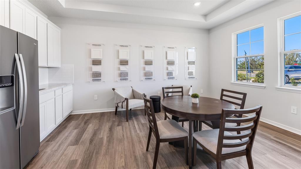 17932 Gander Terrace Lakewood Ranch, FL 34211 - Photo 18 of 52 a view of a dining room with furniture and window