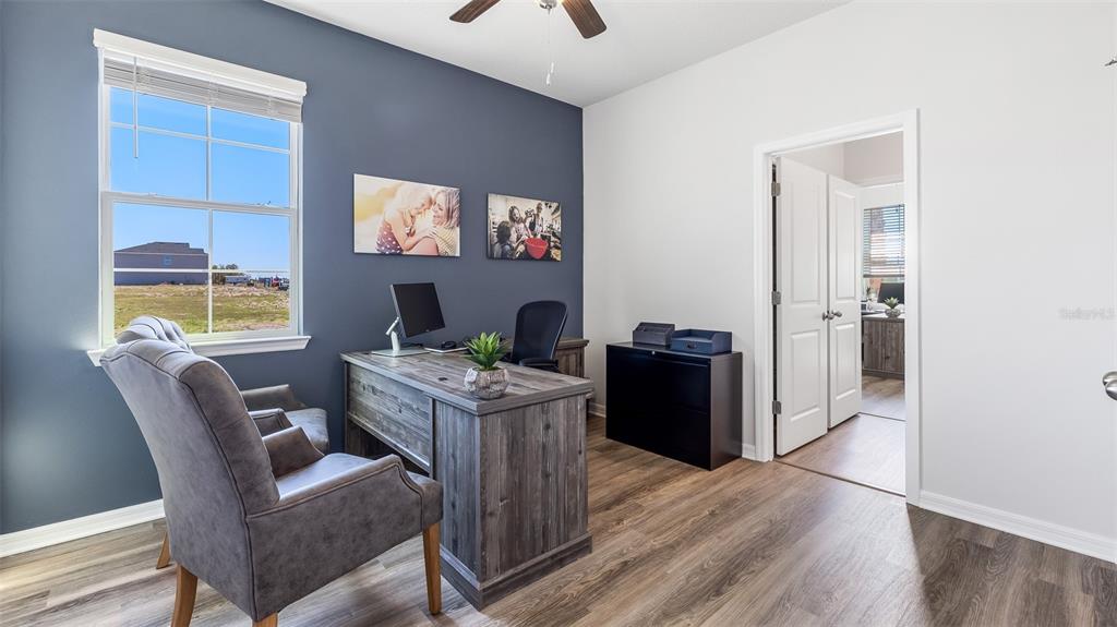 17932 Gander Terrace Lakewood Ranch, FL 34211 - Photo 20 of 52 a work room with furniture and wooden floor