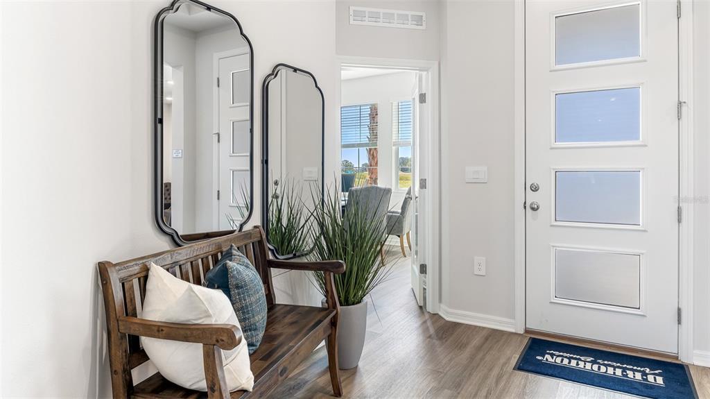 17932 Gander Terrace Lakewood Ranch, FL 34211 - Photo 23 of 52 a room with furniture and wooden floor