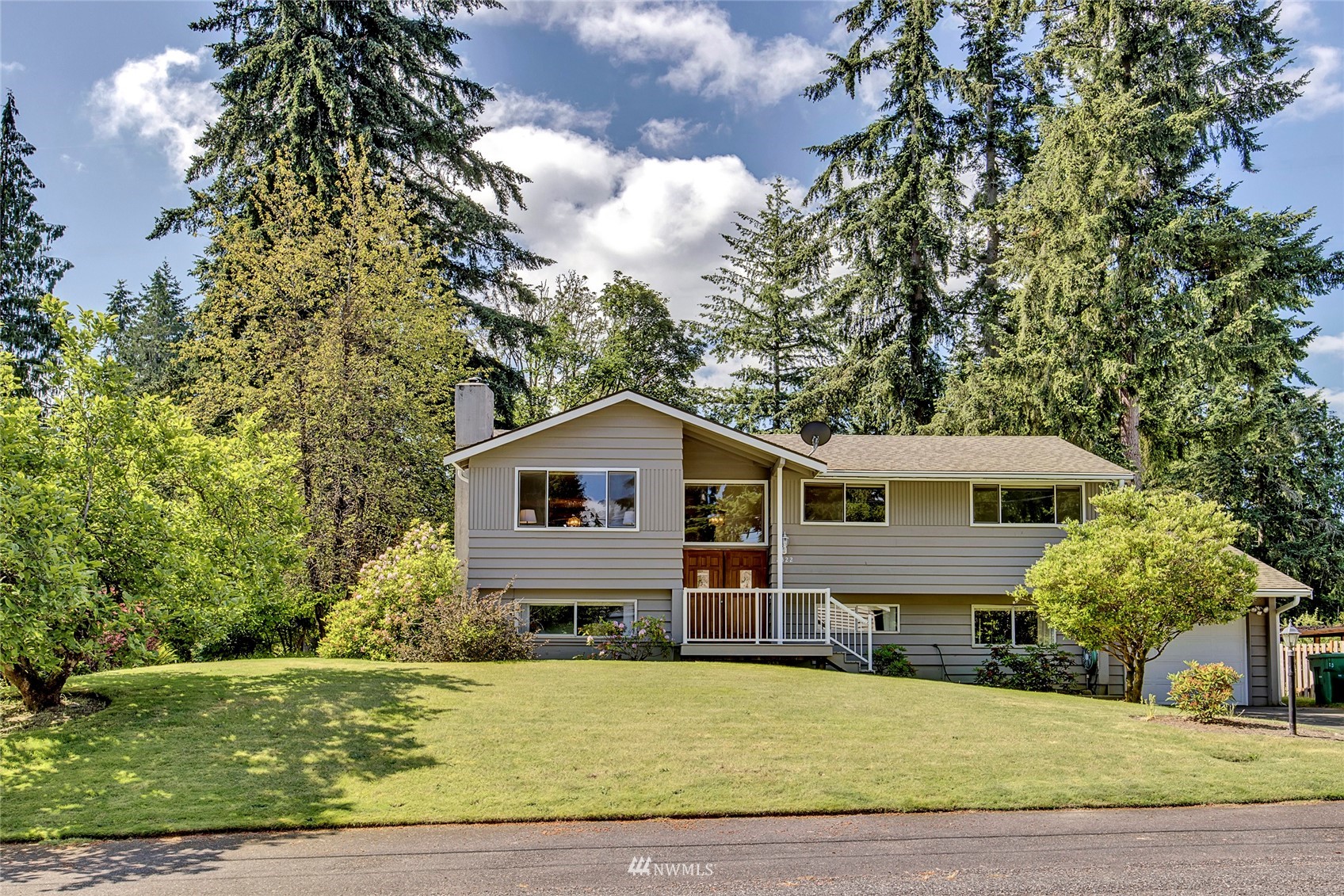 2322 243rd Place Southwest Bothell, WA 98021 - Photo 1 of 29 a front view of a house with a garden