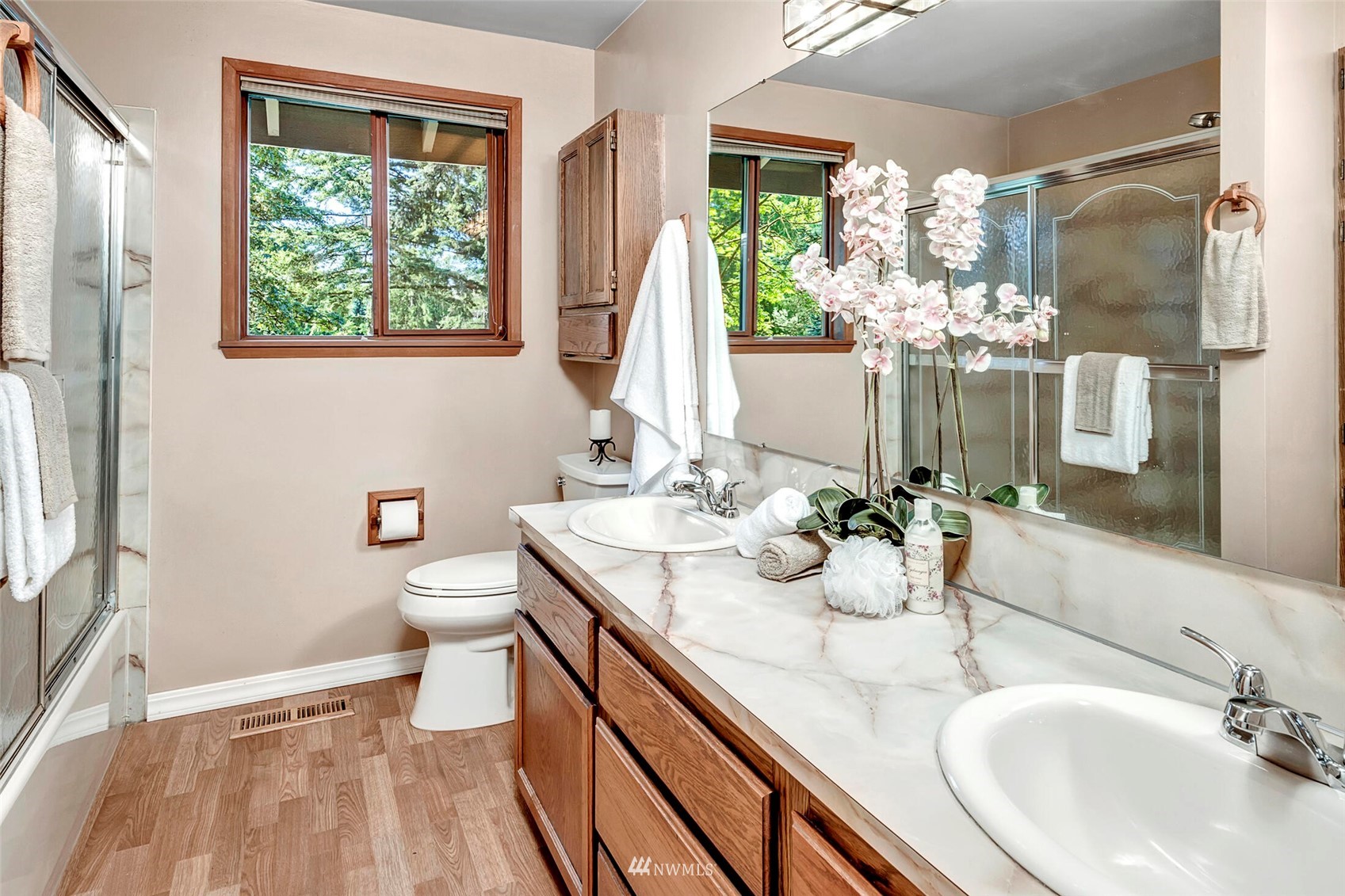 2322 243rd Place Southwest Bothell, WA 98021 - Photo 16 of 29 a bathroom with a granite countertop sink toilet and a large mirror
