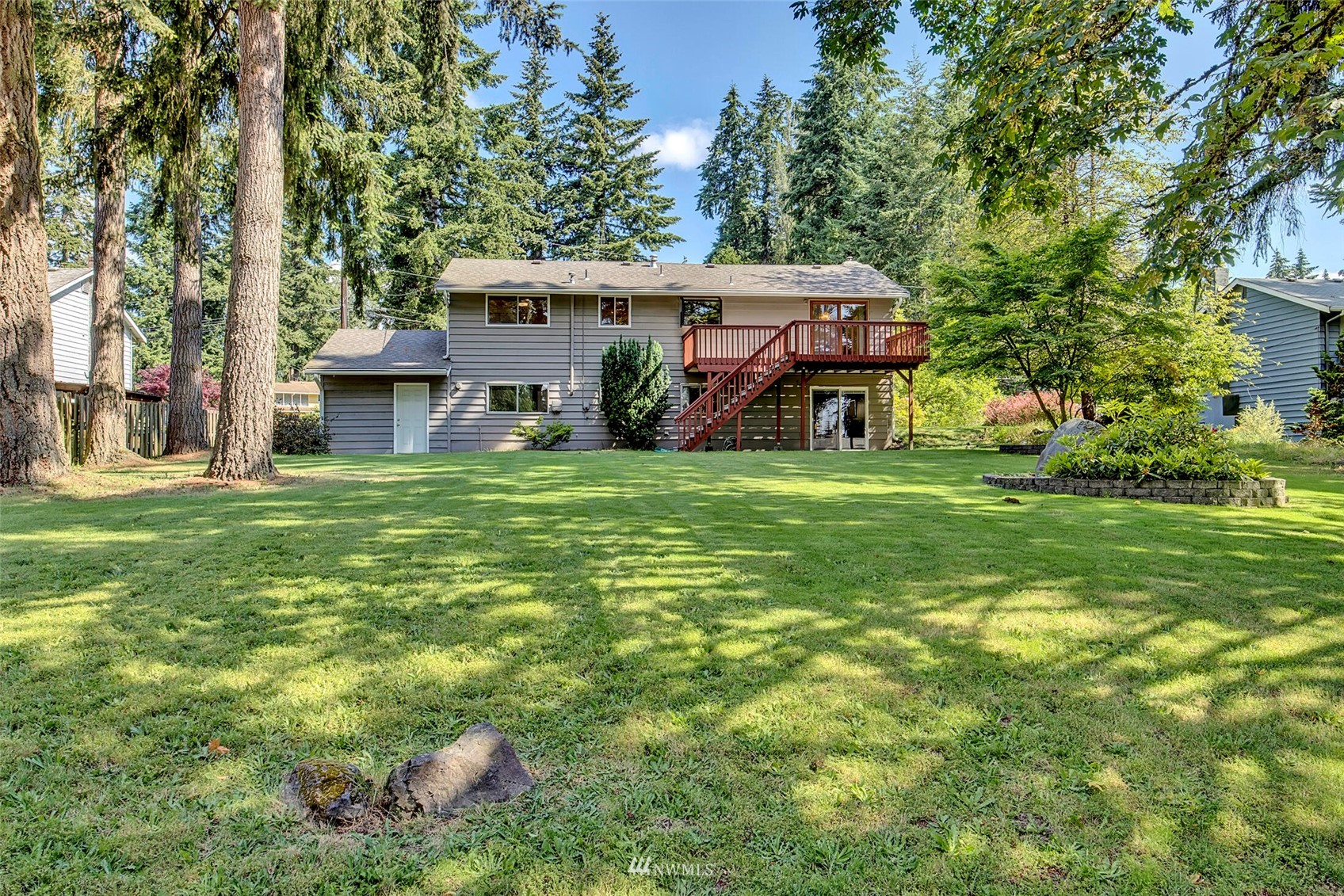2322 243rd Place Southwest Bothell, WA 98021 - Photo 26 of 29 a front view of a house with a garden