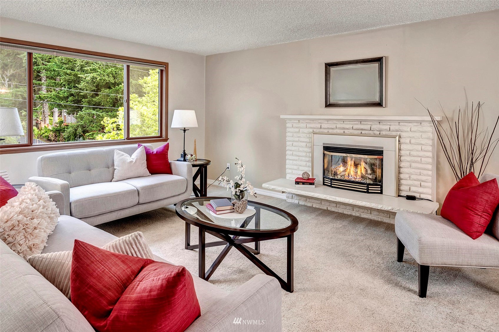 2322 243rd Place Southwest Bothell, WA 98021 - Photo 3 of 29 a living room with furniture and a fireplace