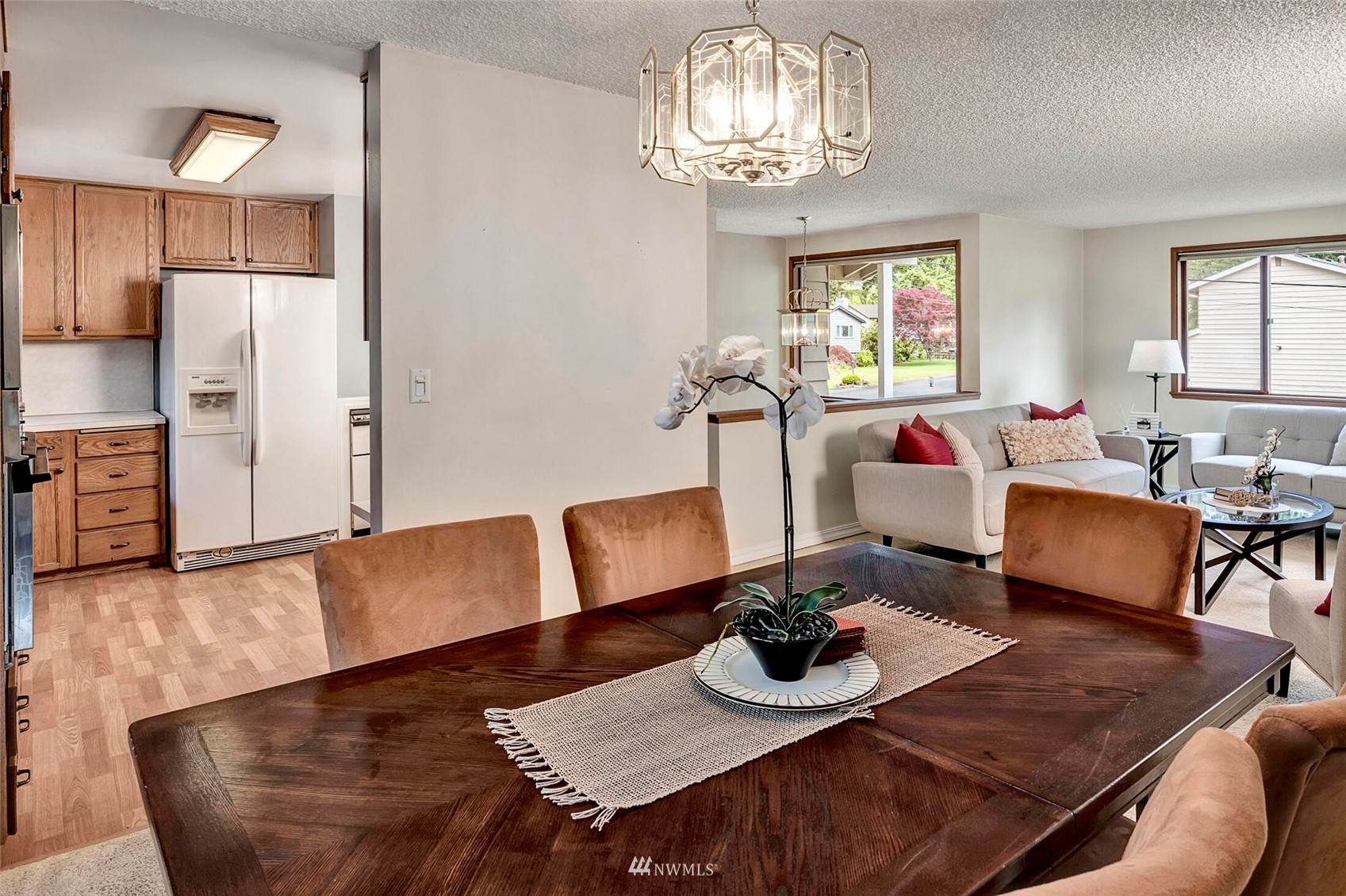 2322 243rd Place Southwest Bothell, WA 98021 - Photo 7 of 29 a living room with furniture and a chandelier
