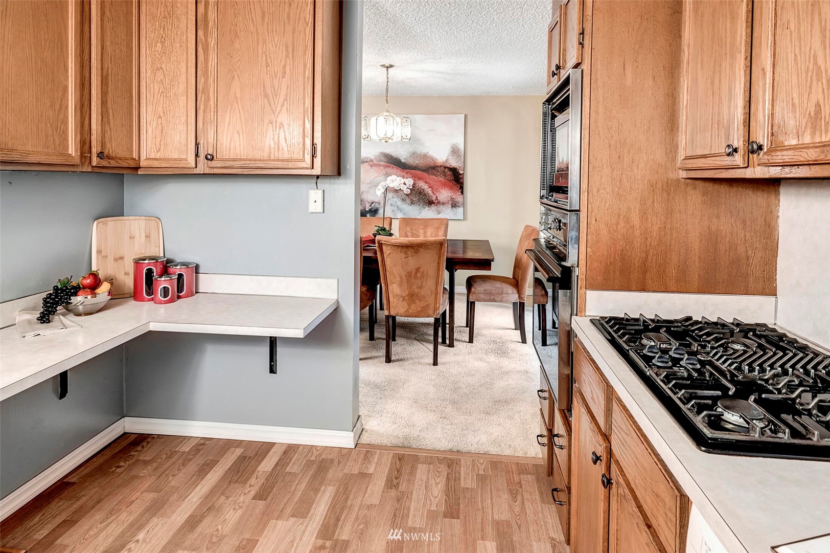 2322 243rd Place Southwest Bothell, WA 98021 - Photo 10 of 29 a kitchen with stainless steel appliances granite countertop a refrigerator and a stove top oven