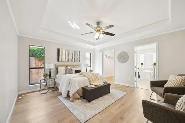 a bed room with furniture and a chandelier