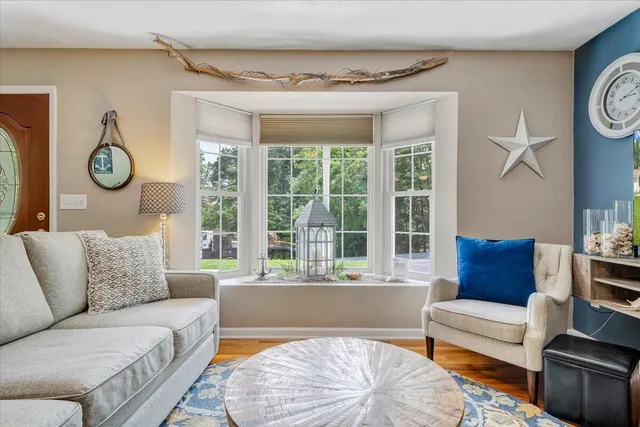 a view of a dining room with furniture and a chandelier
