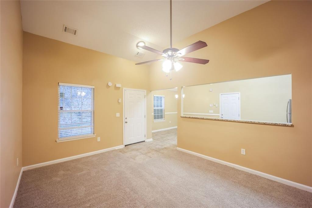 4827 Wolfcreek View Atlanta, GA 30349 - Photo 5 of 7 a view of an empty room with a window