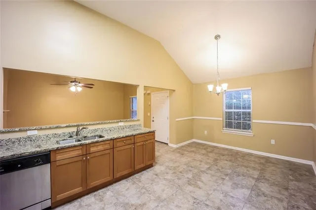 a view of a kitchen with a sink and dishwasher
