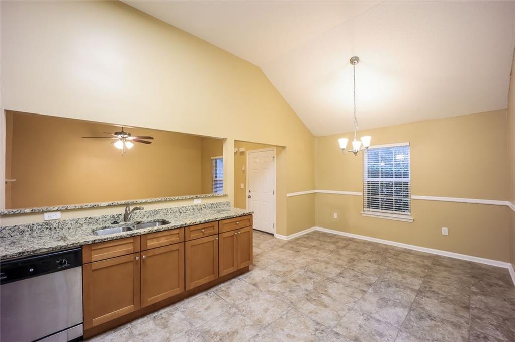 4827 Wolfcreek View Atlanta, GA 30349 - Photo 7 of 7 a view of a kitchen with a sink and dishwasher