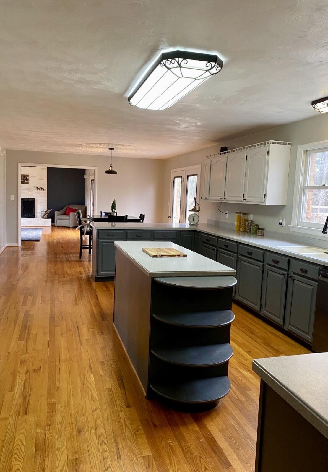 4670 Brookridge Road Hardy, VA 24101 - Photo 8 of 69 a kitchen with stainless steel appliances granite countertop a sink a stove and a wooden floors