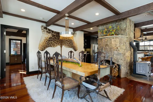 a view of a chairs and table in the balcony