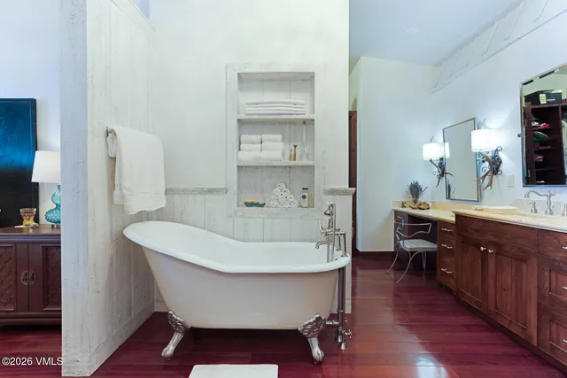 a dining room with furniture and a floor to ceiling window
