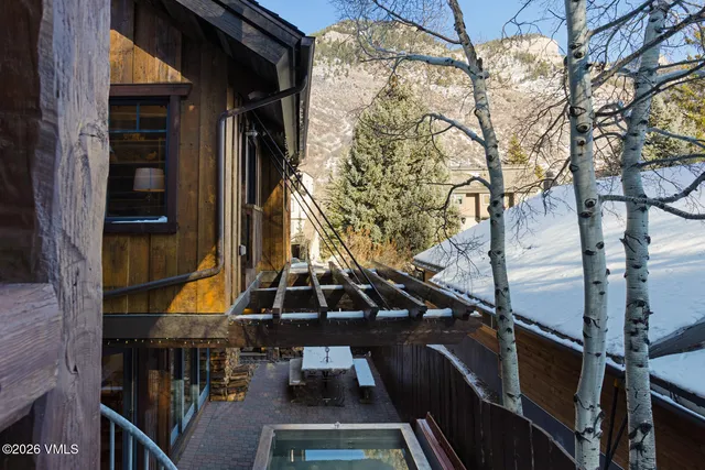 a bedroom with a bed and a mirror