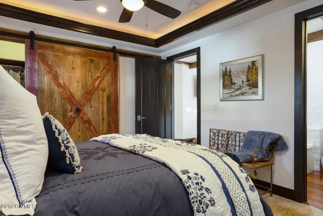 a kitchen with a table chairs refrigerator and microwave