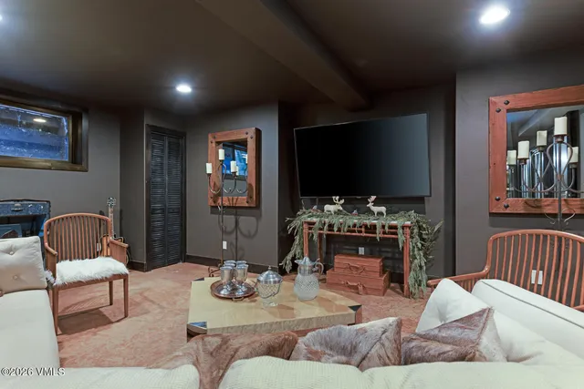 a living room with furniture wooden floor and a table