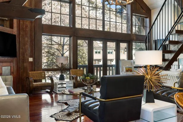 a living room with fireplace furniture and a flat screen tv
