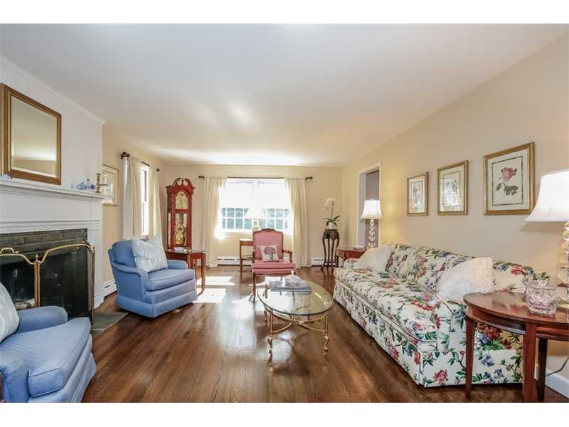 6 Windsor Road Darien, CT 06820 - Photo 4 of 25 a living room with furniture and a fireplace